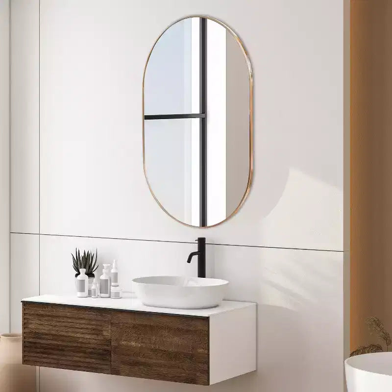 Miroir mural ovale à cadre métallique