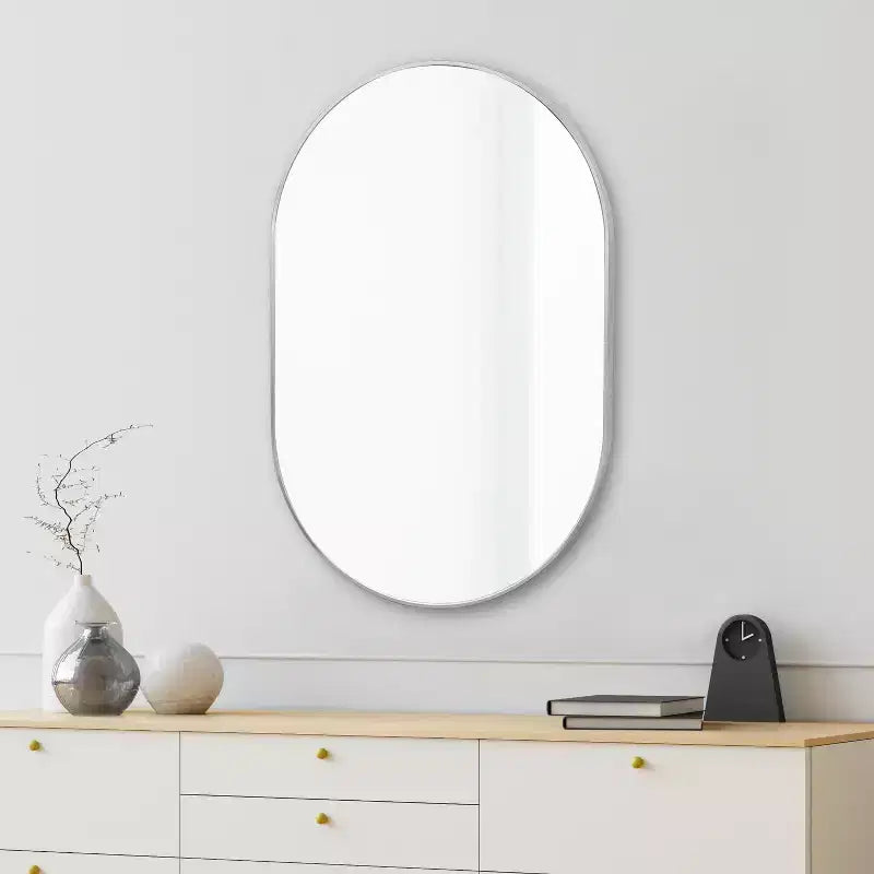 Miroir mural ovale à cadre métallique