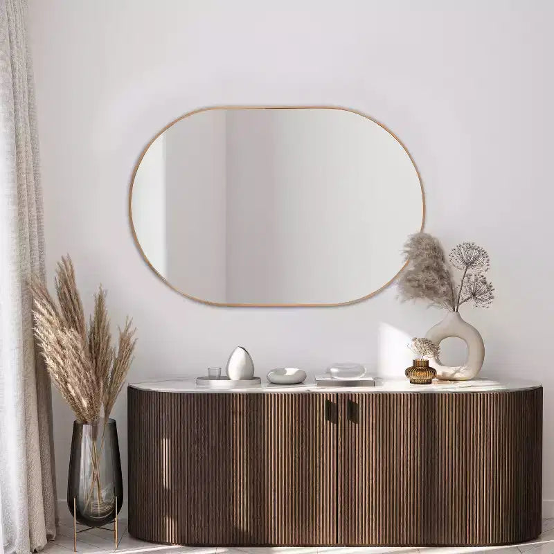 Miroir mural ovale à cadre métallique