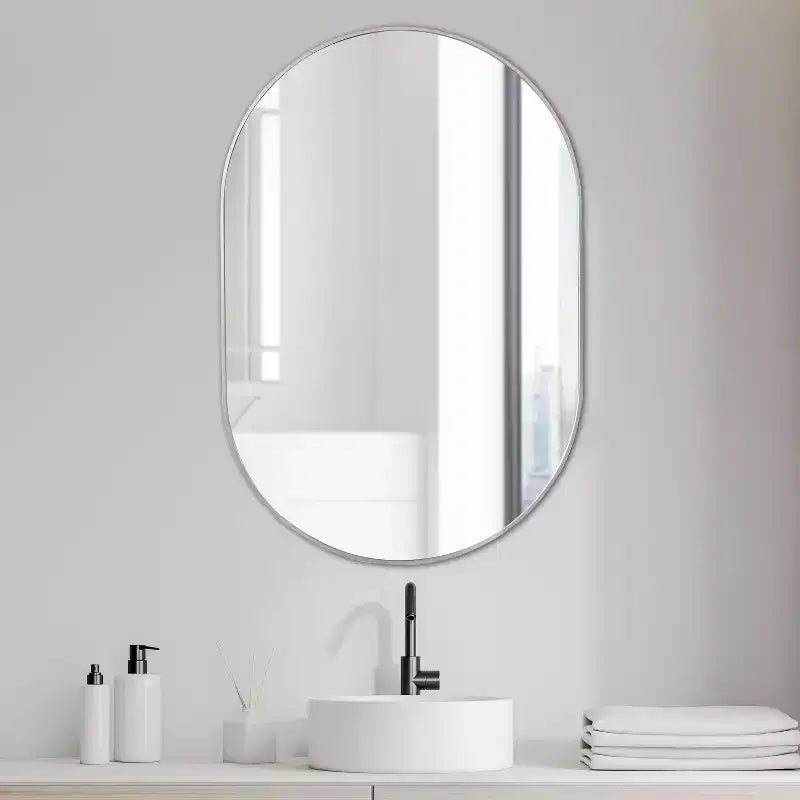 Miroir mural ovale à cadre métallique